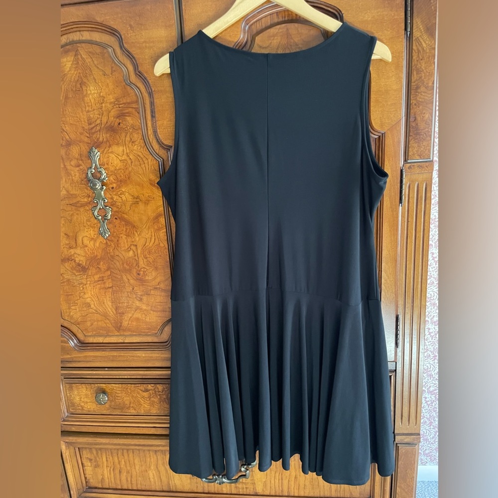 Loose dress with extra fabric panels at bottom.